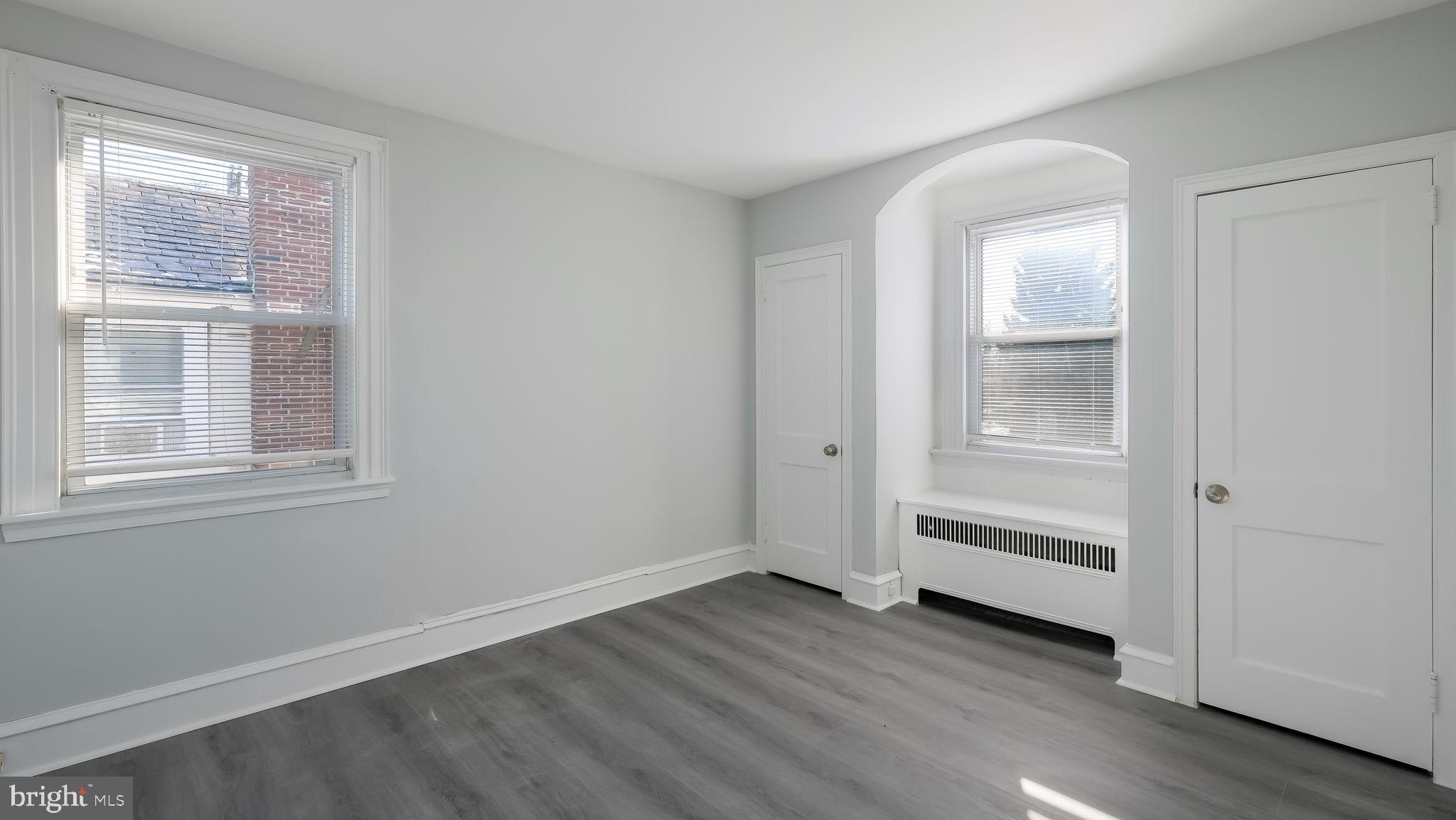 2035 Ripley Street Philadelphia, PA 19152 - Photo 16 of 30 an empty room with wooden floor closet and windows