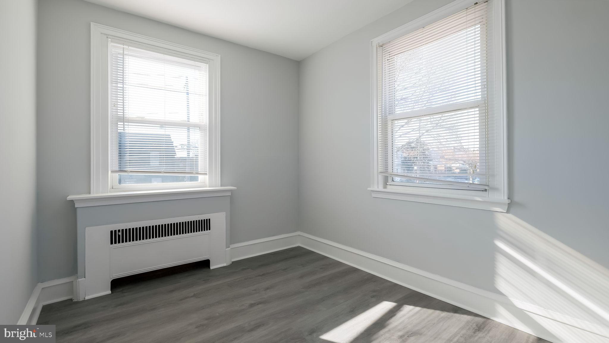 2035 Ripley Street Philadelphia, PA 19152 - Photo 17 of 30 a view of an empty room with wooden floor and a window
