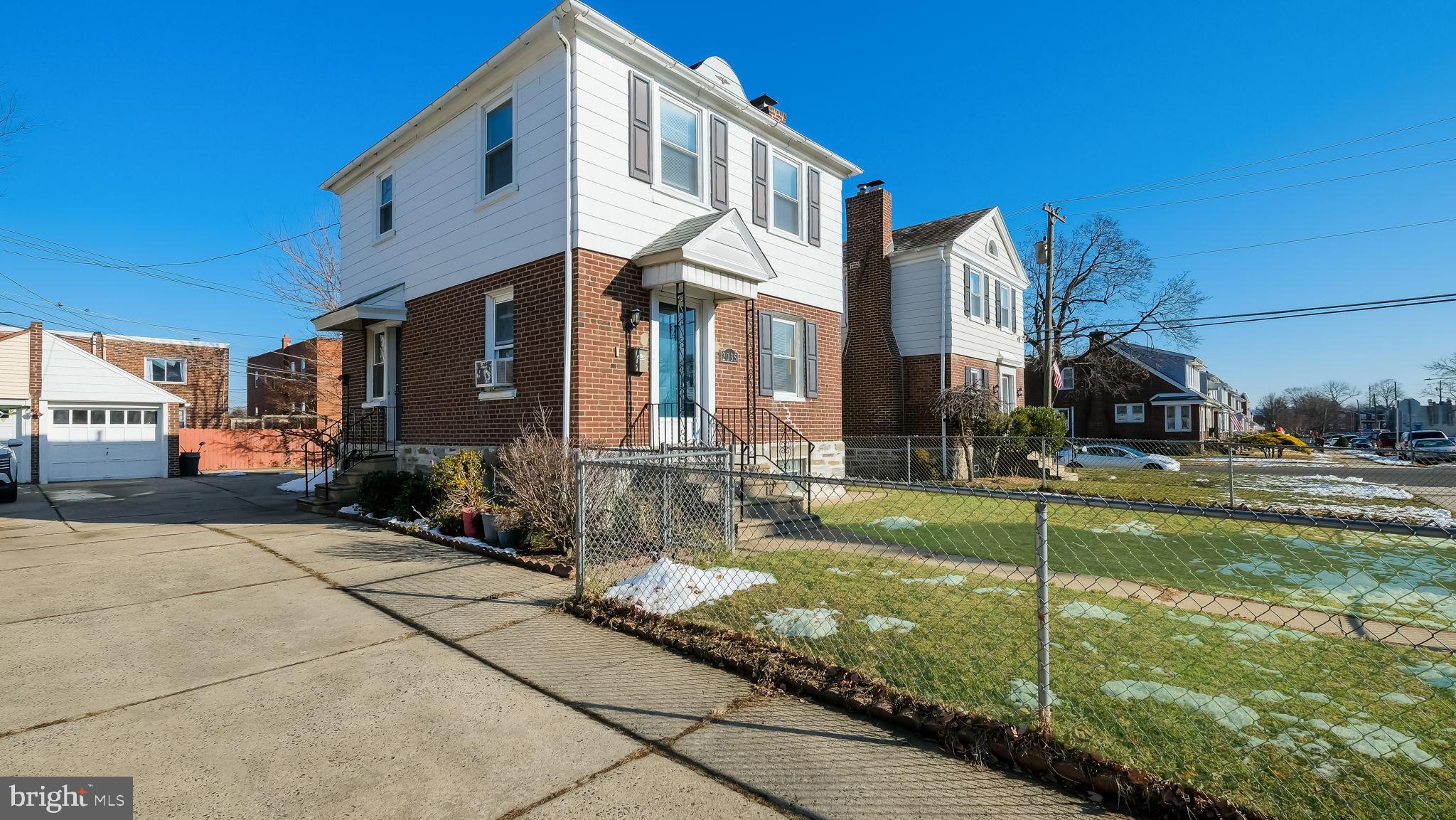 2035 Ripley Street Philadelphia, PA 19152 - Photo 4 of 30 a front view of a building with garden