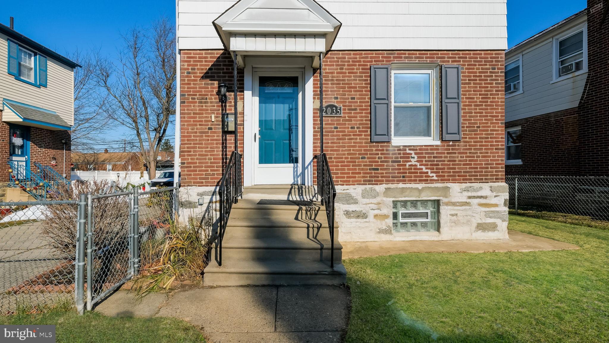 2035 Ripley Street Philadelphia, PA 19152 - Photo 5 of 30 a view of a brick house with many windows
