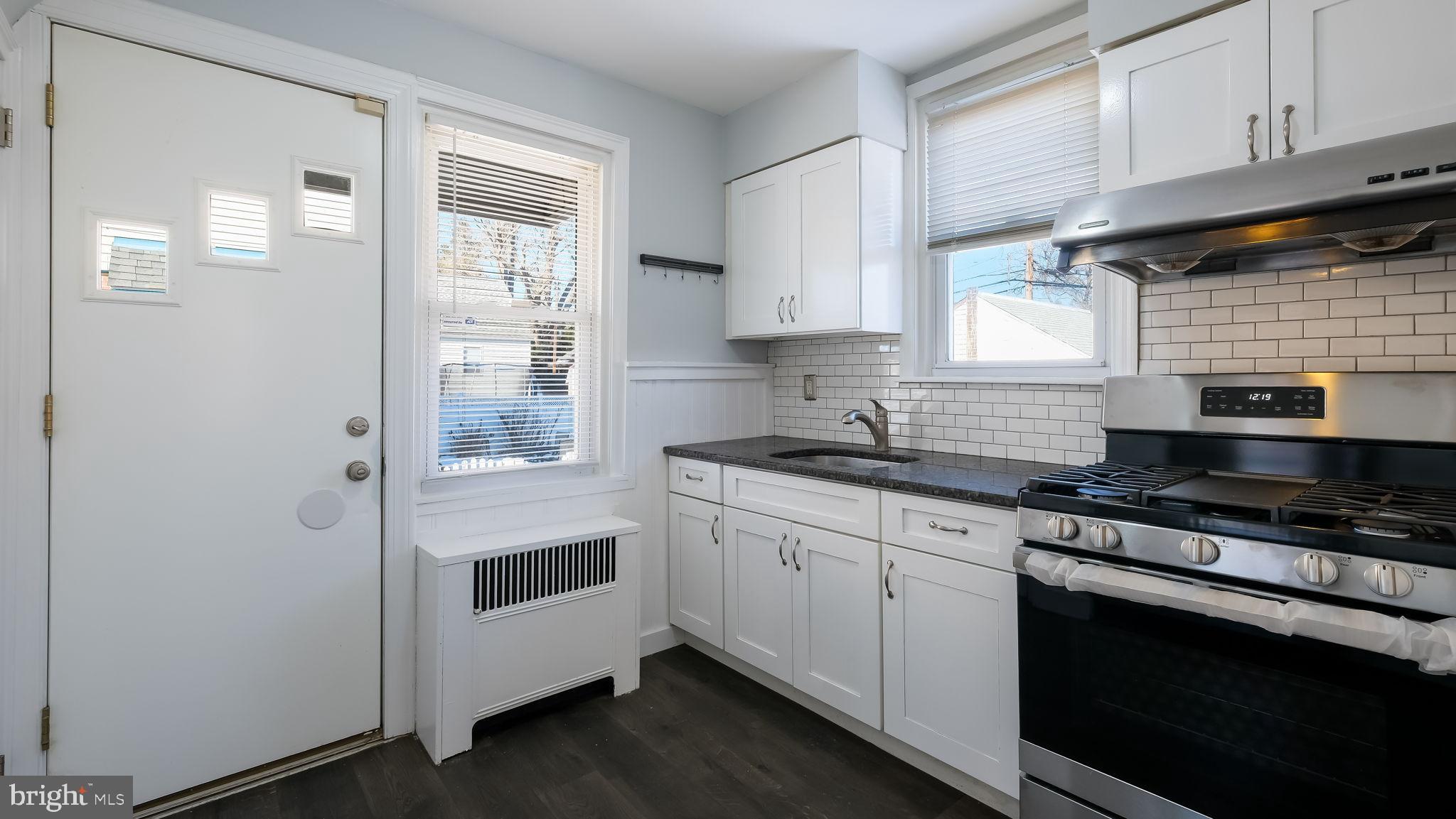 2035 Ripley Street Philadelphia, PA 19152 - Photo 6 of 30 a kitchen with cabinets appliances and a window