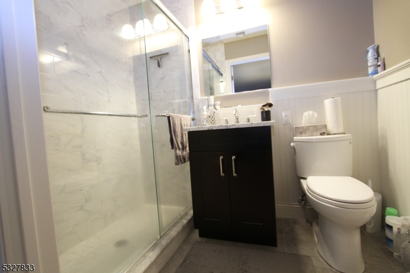 70 Harristown Road, Unit 3 Fair Lawn, NJ 07410 - Photo 16 of 20 a bathroom with a sink toilet and shower