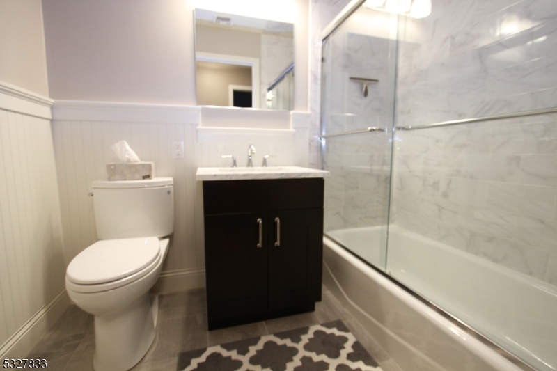 70 Harristown Road, Unit 3 Fair Lawn, NJ 07410 - Photo 19 of 20 a bathroom with a sink toilet and shower