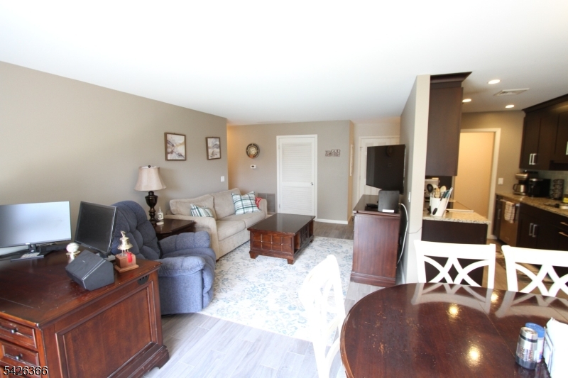70 Harristown Road, Unit 3 Fair Lawn, NJ 07410 - Photo 9 of 20 a living room with furniture and a wooden floor
