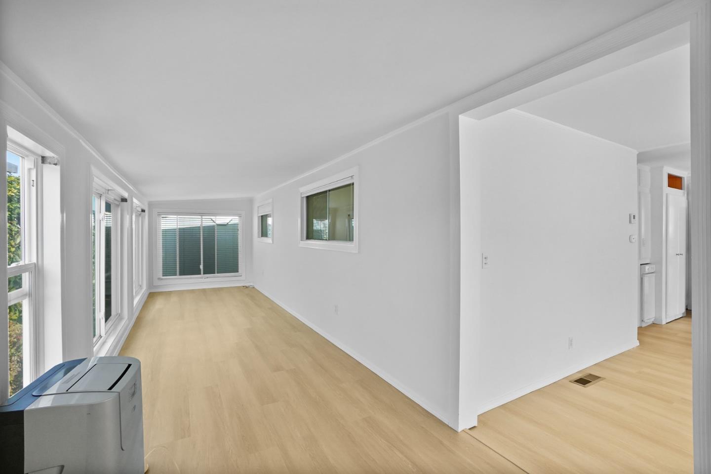 7 Sea Shell Circle, Unit 7 Half Moon Bay, CA 94019 - Photo 11 of 36 a view of an empty room with wooden floor and a window