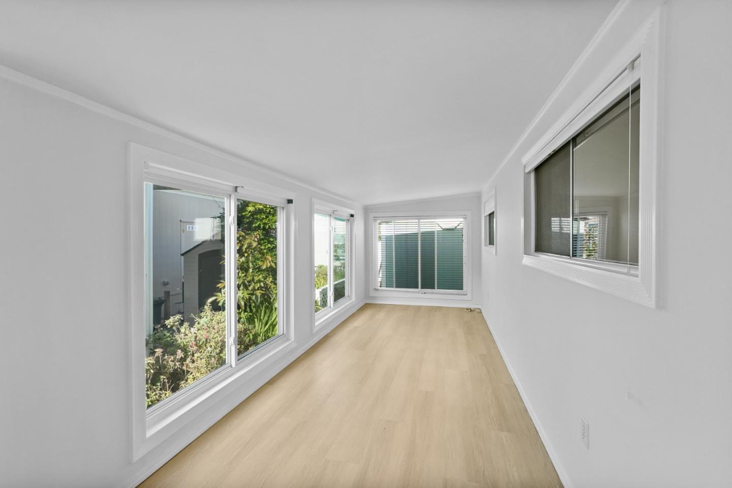 7 Sea Shell Circle, Unit 7 Half Moon Bay, CA 94019 - Photo 12 of 36 a view of an entryway with wooden floor and garden