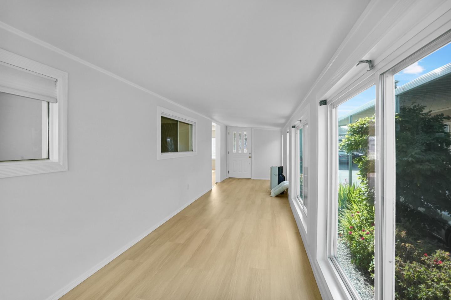 7 Sea Shell Circle, Unit 7 Half Moon Bay, CA 94019 - Photo 13 of 36 a view of a big room with wooden floor and windows