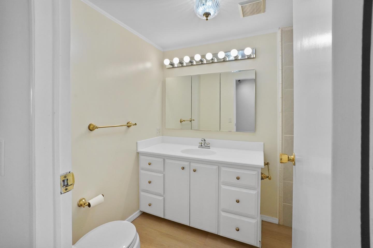 7 Sea Shell Circle, Unit 7 Half Moon Bay, CA 94019 - Photo 14 of 36 a bathroom with a sink vanity and a mirror