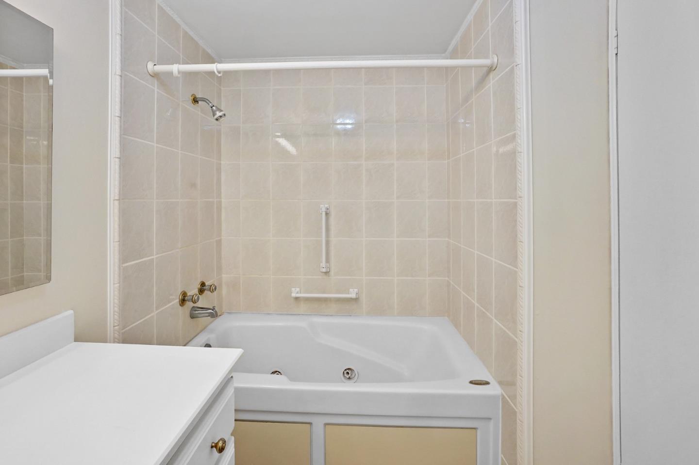 7 Sea Shell Circle, Unit 7 Half Moon Bay, CA 94019 - Photo 15 of 36 a bathroom with a tub and shower
