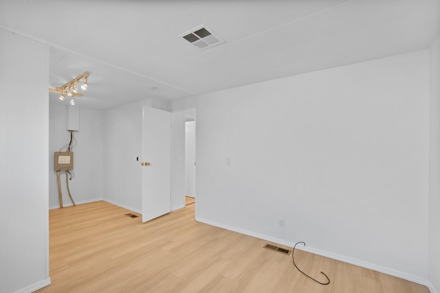 7 Sea Shell Circle, Unit 7 Half Moon Bay, CA 94019 - Photo 18 of 36 a view of a room with closet and wooden floor
