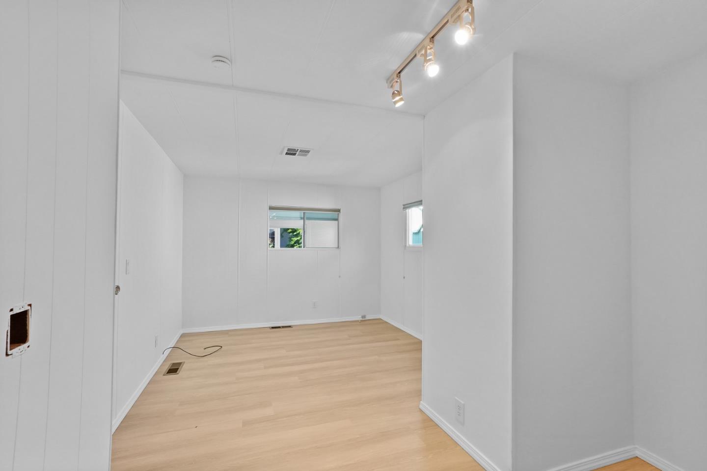 7 Sea Shell Circle, Unit 7 Half Moon Bay, CA 94019 - Photo 19 of 36 wooden floor in an empty room