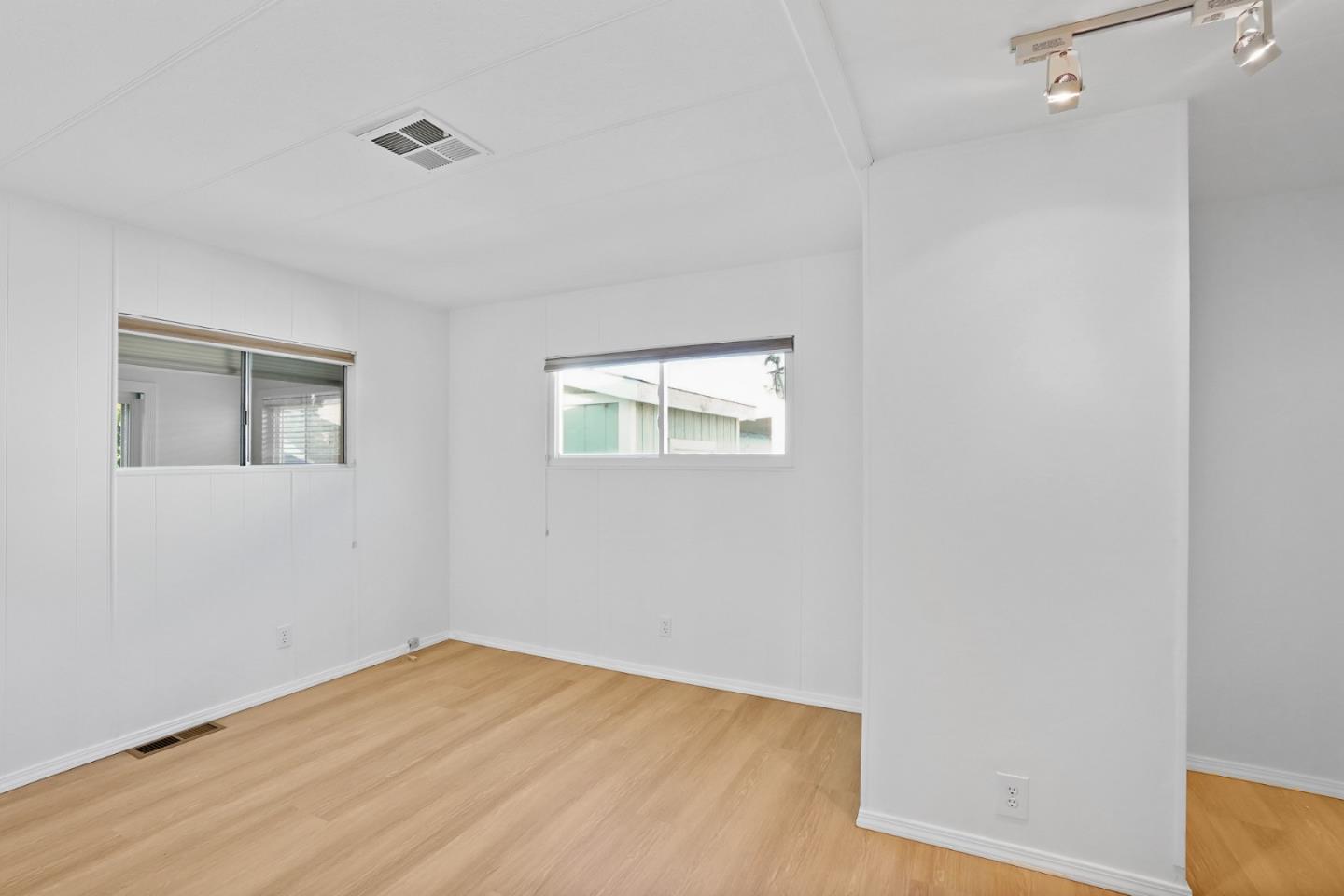 7 Sea Shell Circle, Unit 7 Half Moon Bay, CA 94019 - Photo 20 of 36 a view of a big room with wooden floor and windows