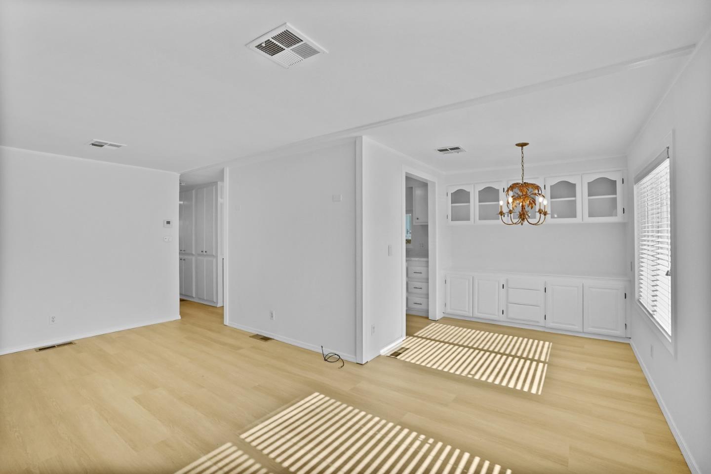 7 Sea Shell Circle, Unit 7 Half Moon Bay, CA 94019 - Photo 21 of 36 a view of a room with wooden floor and windows