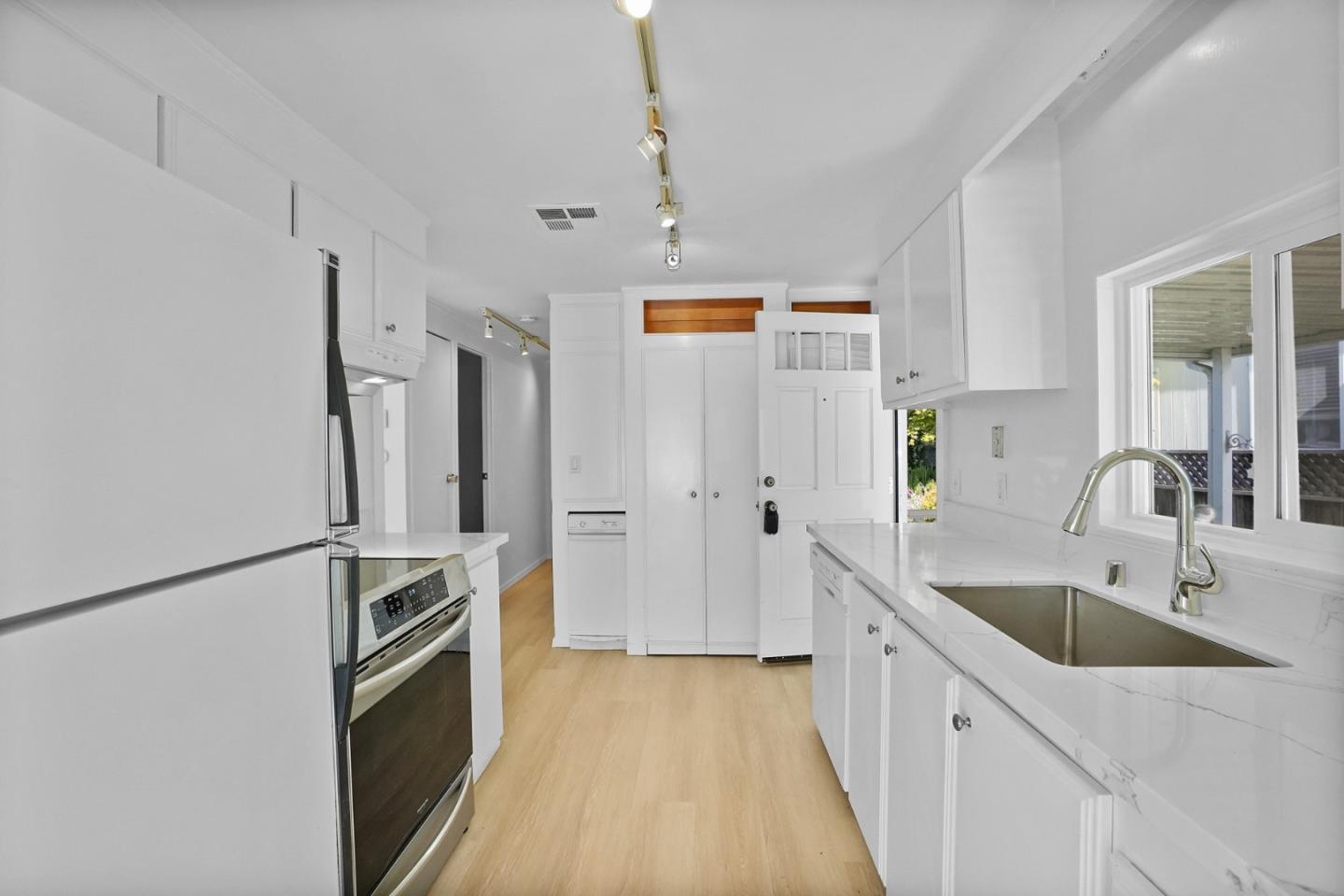 7 Sea Shell Circle, Unit 7 Half Moon Bay, CA 94019 - Photo 23 of 36 a kitchen with stainless steel appliances a refrigerator sink and stove