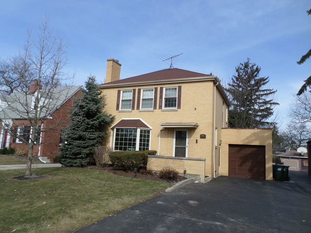 444 Loudon Road Riverside, IL 60546 - Photo 1 of 23 a front view of a house with a garden