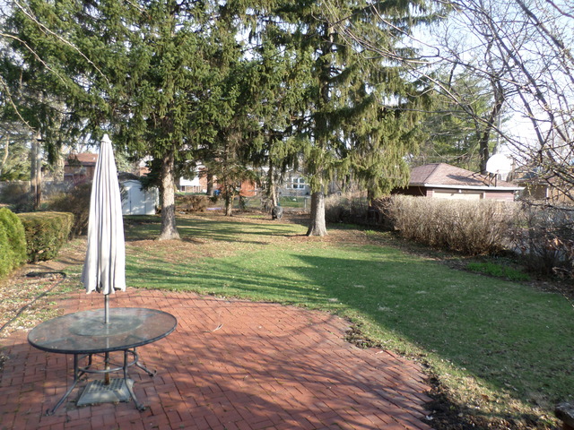 444 Loudon Road Riverside, IL 60546 - Photo 16 of 23 a backyard of a house with table and chairs