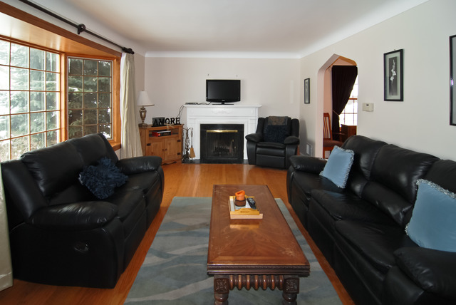 444 Loudon Road Riverside, IL 60546 - Photo 3 of 23 a living room with furniture and a fireplace