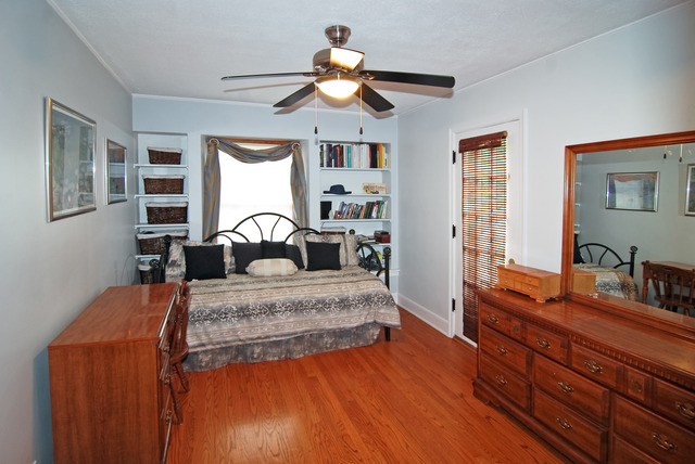 444 Loudon Road Riverside, IL 60546 - Photo 8 of 23 a bedroom with a bed and wooden floor