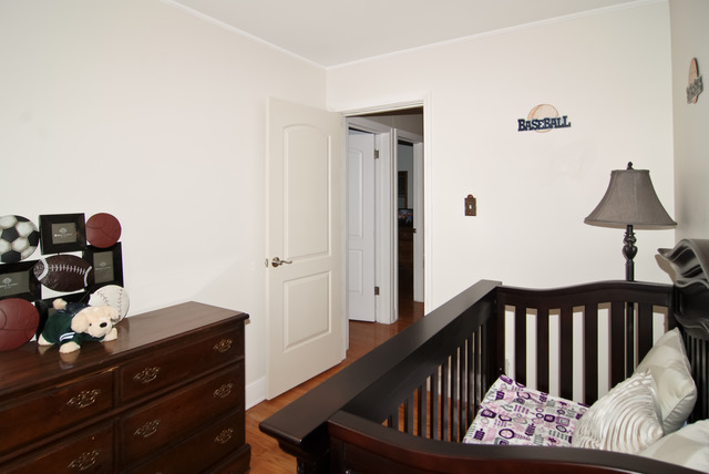 444 Loudon Road Riverside, IL 60546 - Photo 9 of 23 a bedroom with furniture and wooden floor