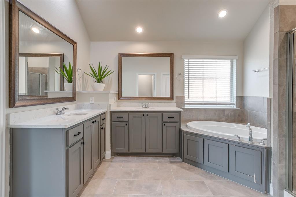 15141 Fleet Hill Road Aledo, TX 76008 - Photo 14 of 37 a bathroom with a granite countertop sink double vanity mirror and a bathtub
