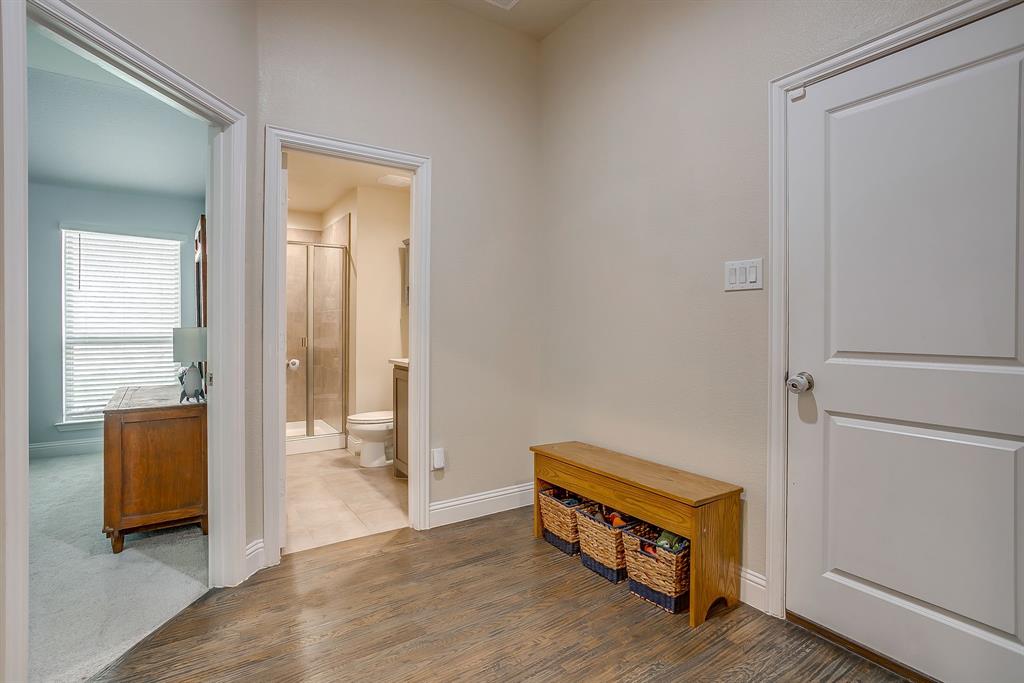 15141 Fleet Hill Road Aledo, TX 76008 - Photo 23 of 37 a room with furniture and wooden floor