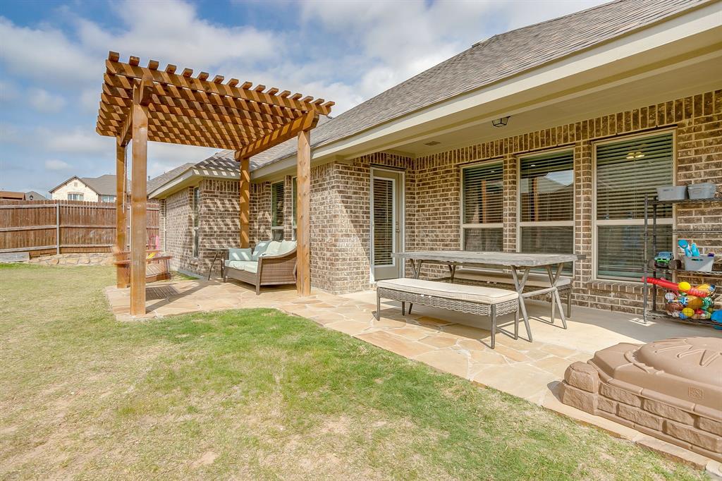 15141 Fleet Hill Road Aledo, TX 76008 - Photo 28 of 37 a view of a house with backyard porch and sitting area