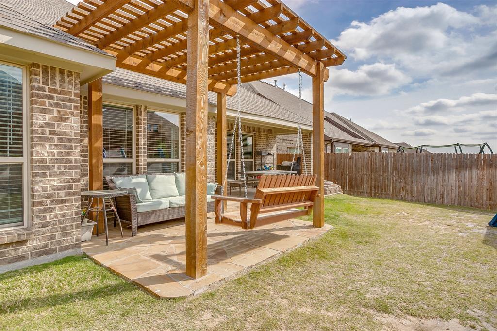 15141 Fleet Hill Road Aledo, TX 76008 - Photo 29 of 37 a view of a bench in the backyard of house