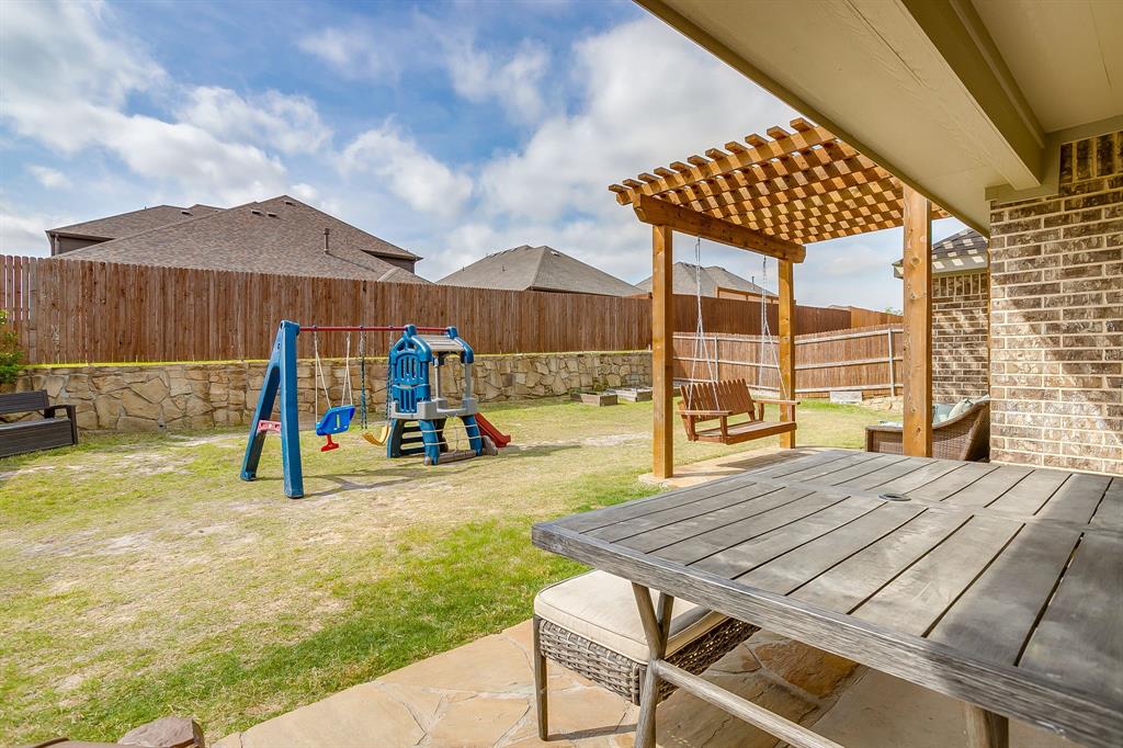 15141 Fleet Hill Road Aledo, TX 76008 - Photo 30 of 37 a view of a patio with a table and chairs