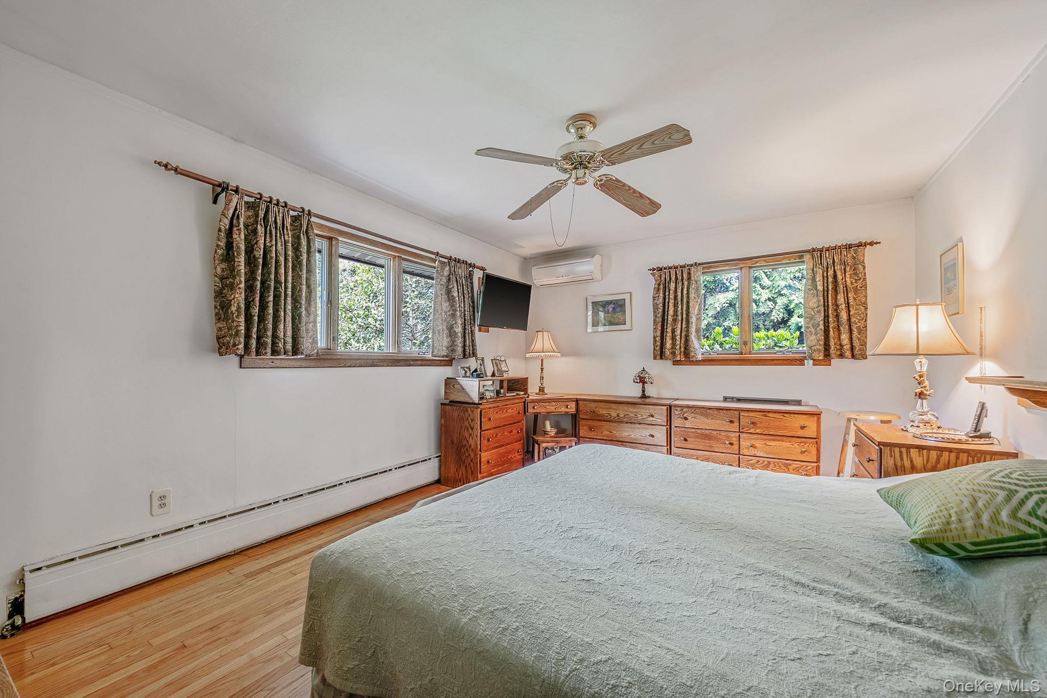 280 Deforest Road North Dix Hills, NY 11746 - Photo 25 of 37 a bedroom with furniture and a large window