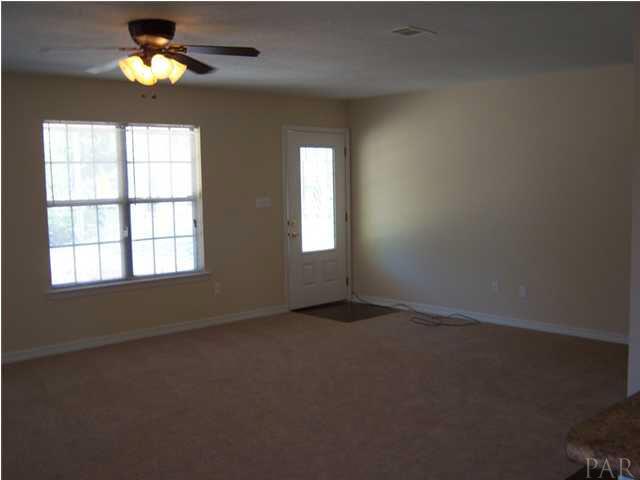 5220 Arrowhead Road Pensacola, FL 32507 - Photo 8 of 10 Living room looking toward leaded glassed front door.