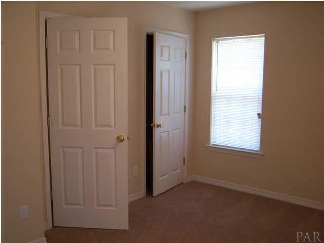 5220 Arrowhead Road Pensacola, FL 32507 - Photo 10 of 10 Master bedroom showing his and hers closets