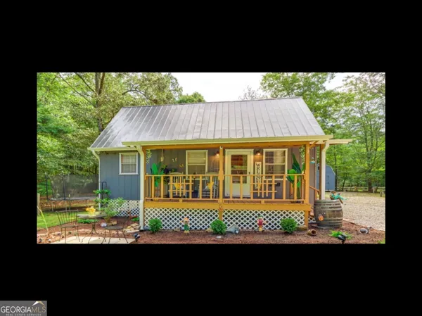 a view of balcony with a garden and deck