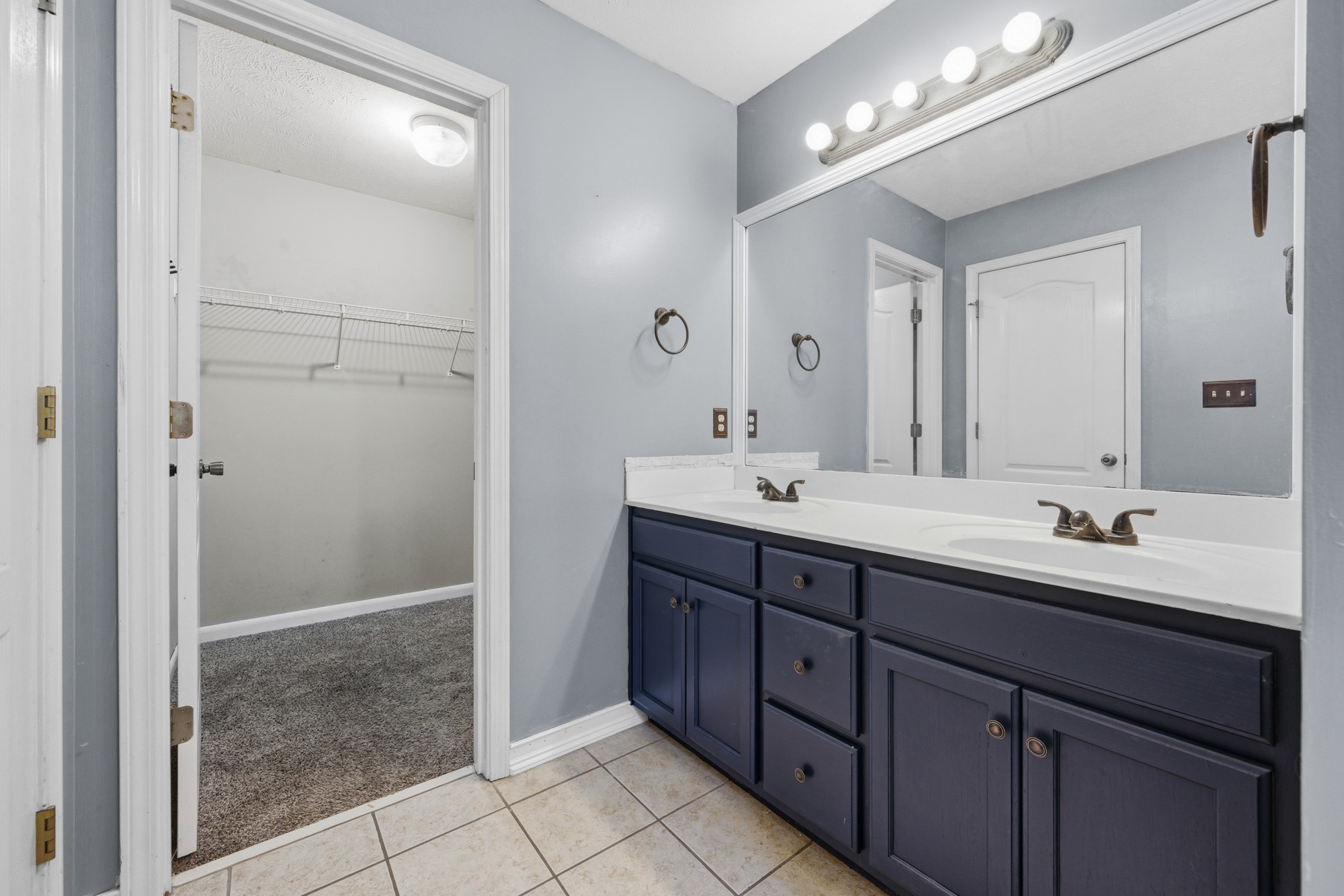 270 Reed Circle Medina, TN 38355 - Photo 20 of 30 a bathroom with a double vanity sink mirror and shower