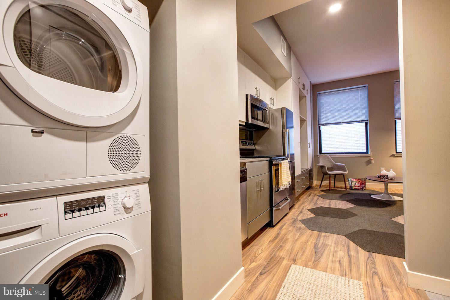 42 South 15th Street, Unit 1B0601 Philadelphia, PA 19102 - Photo 35 of 36 a view of a kitchen with washer and dryer