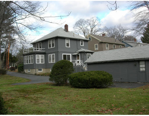 22 Middle Street Lexington, MA 02421 - Photo 4 of 5 a front view of a house with a garden
