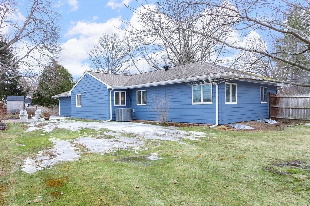 3 Oxbow Road Natick, MA 01760 - Photo 24 of 29 a backyard of a house with large trees and wooden fence