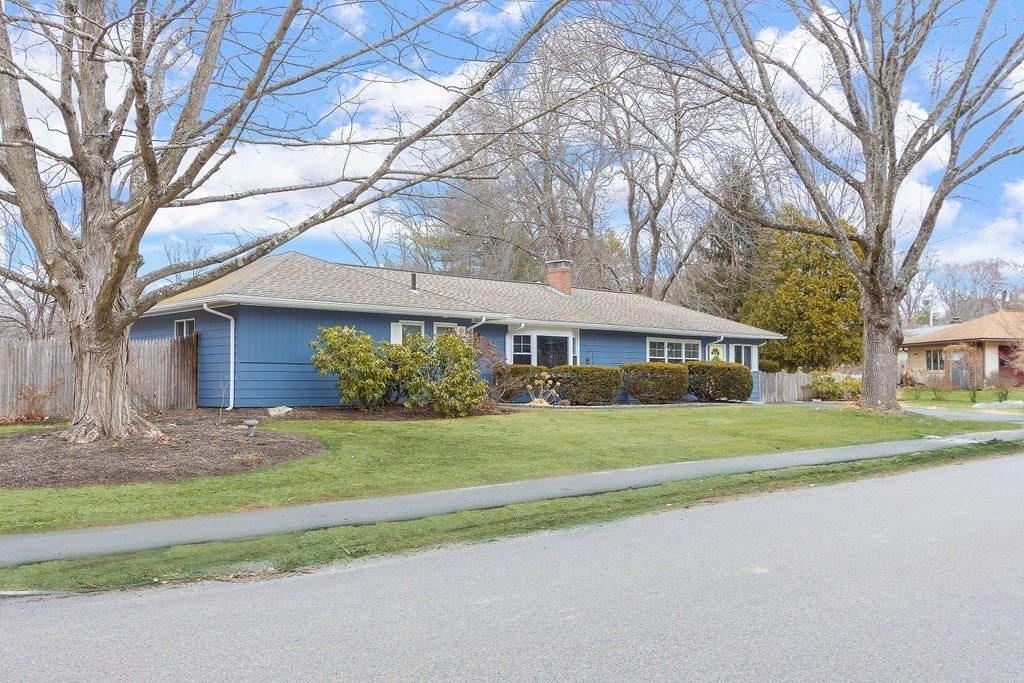 3 Oxbow Road Natick, MA 01760 - Photo 26 of 29 a front view of a house with a yard and garage