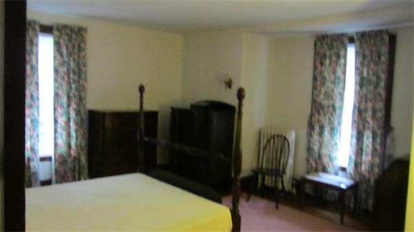 16 Huntington Road Milton, MA 02186 - Photo 11 of 24 a bed room with a bed and a mirror