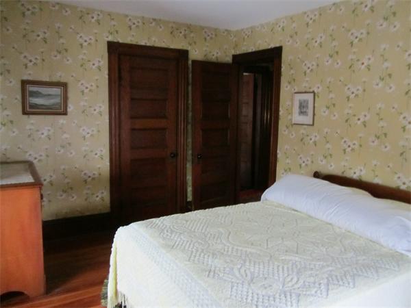 16 Huntington Road Milton, MA 02186 - Photo 15 of 24 a bedroom with a bed and a dresser