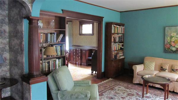 16 Huntington Road Milton, MA 02186 - Photo 17 of 24 a living room with furniture and a book shelf
