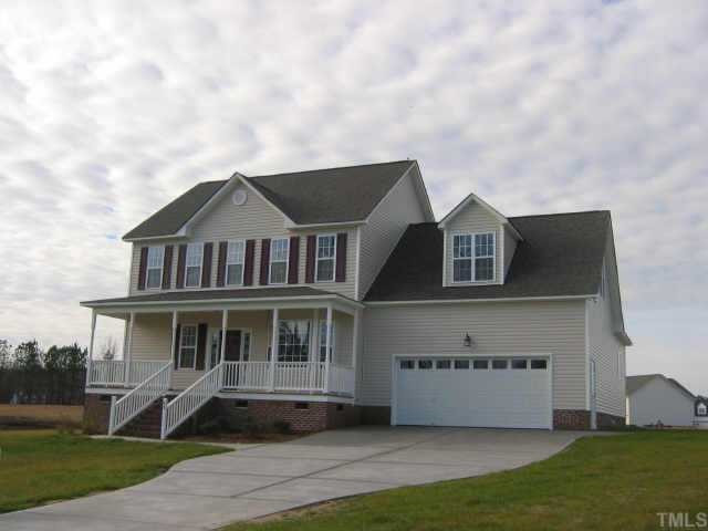 63 Roping Horn Way Willow Spring, NC 27592 - Photo 1 of 1 a front view of a house with a garden