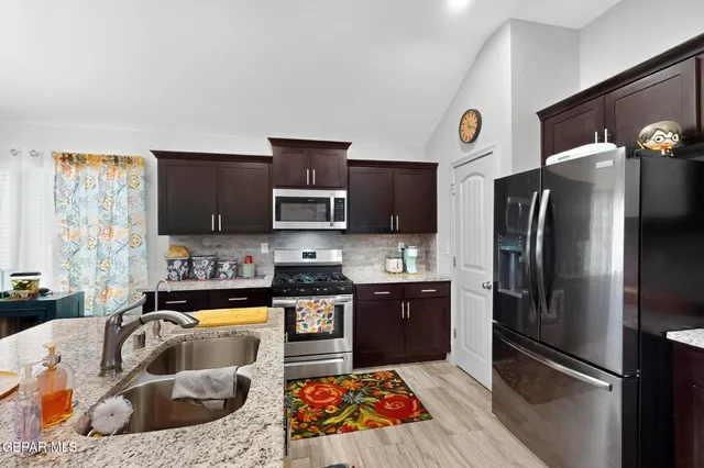 a living room with furniture and a ceiling fan