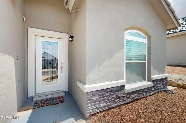 a view of a hallway with windows and couch