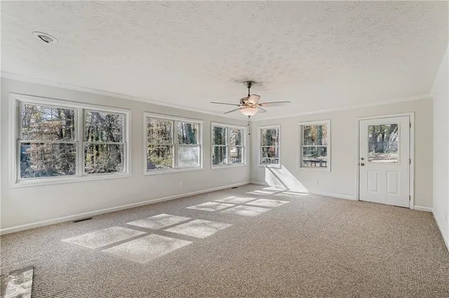 a view of empty room with windows
