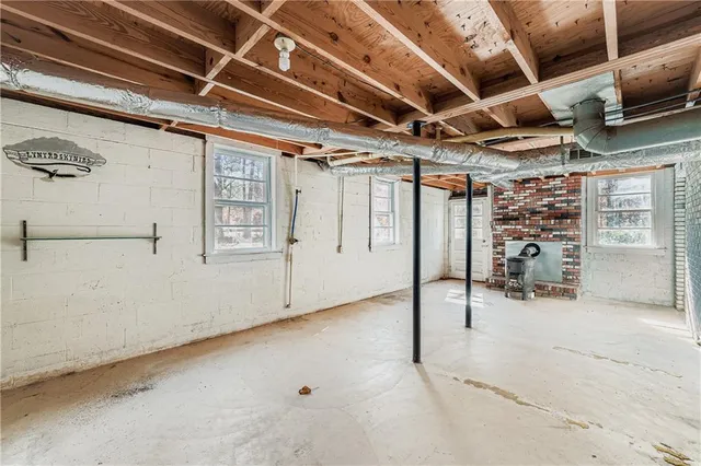a view of a room with wooden ceiling