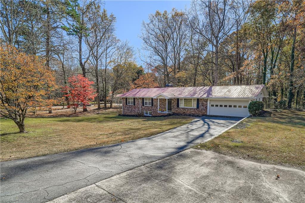 6797 Campground Road Cumming, GA 30040 - Photo 4 of 28 a view of a house with snow on the side of the road