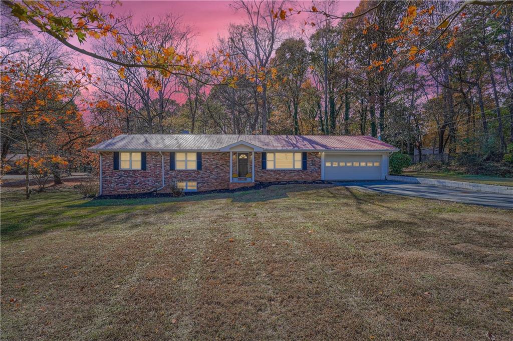6797 Campground Road Cumming, GA 30040 - Photo 5 of 28 a view of a house with a yard and tree s