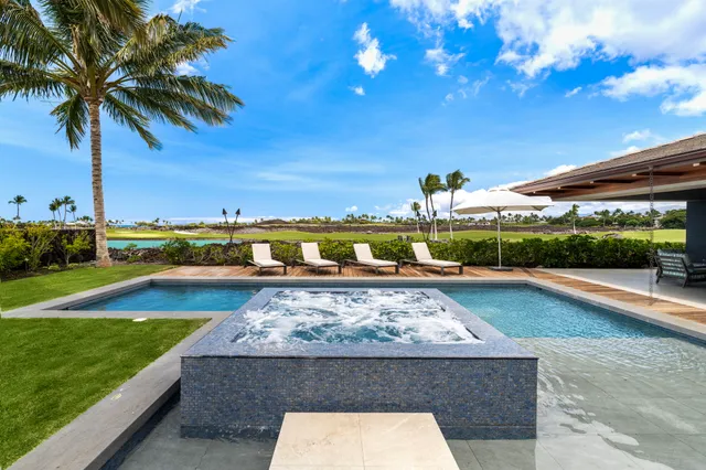 a view of a swimming pool and an outdoor seating