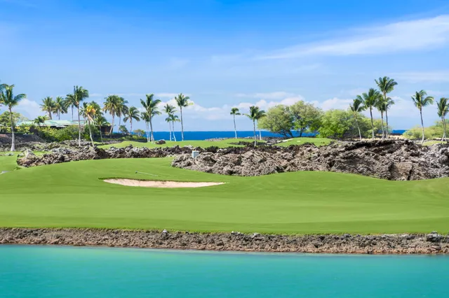 a bedroom with a bed and a mirror