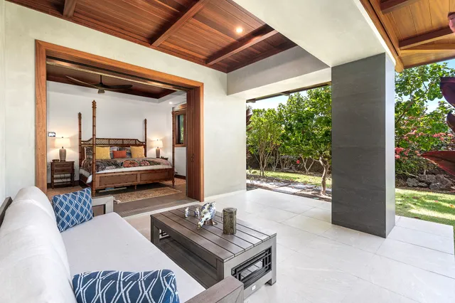 a bathroom with a granite countertop double vanity sink and a mirror